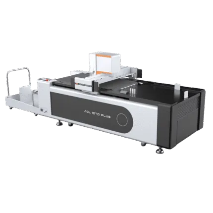 Angled view of the AOL 1070PLUS digital cutting plotter and cutting bed